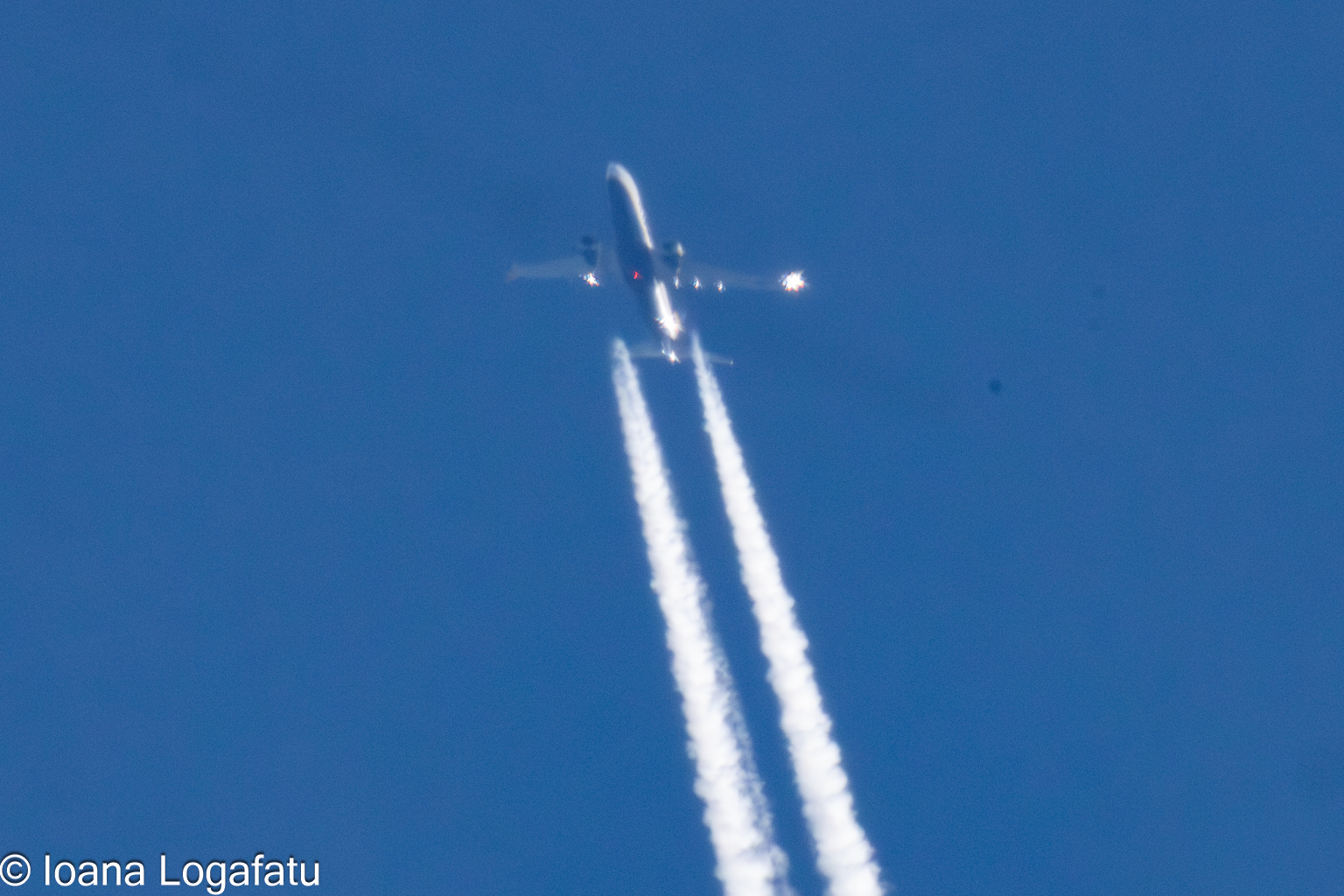 High above the clouds, a jet cuts through the sky